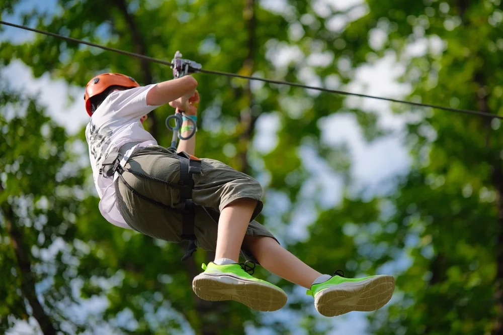 Climb, zip, and swing at Aventura Parks in Mushrif