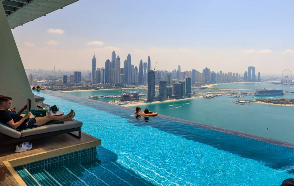 Swim together above the clouds at AURA Skypool