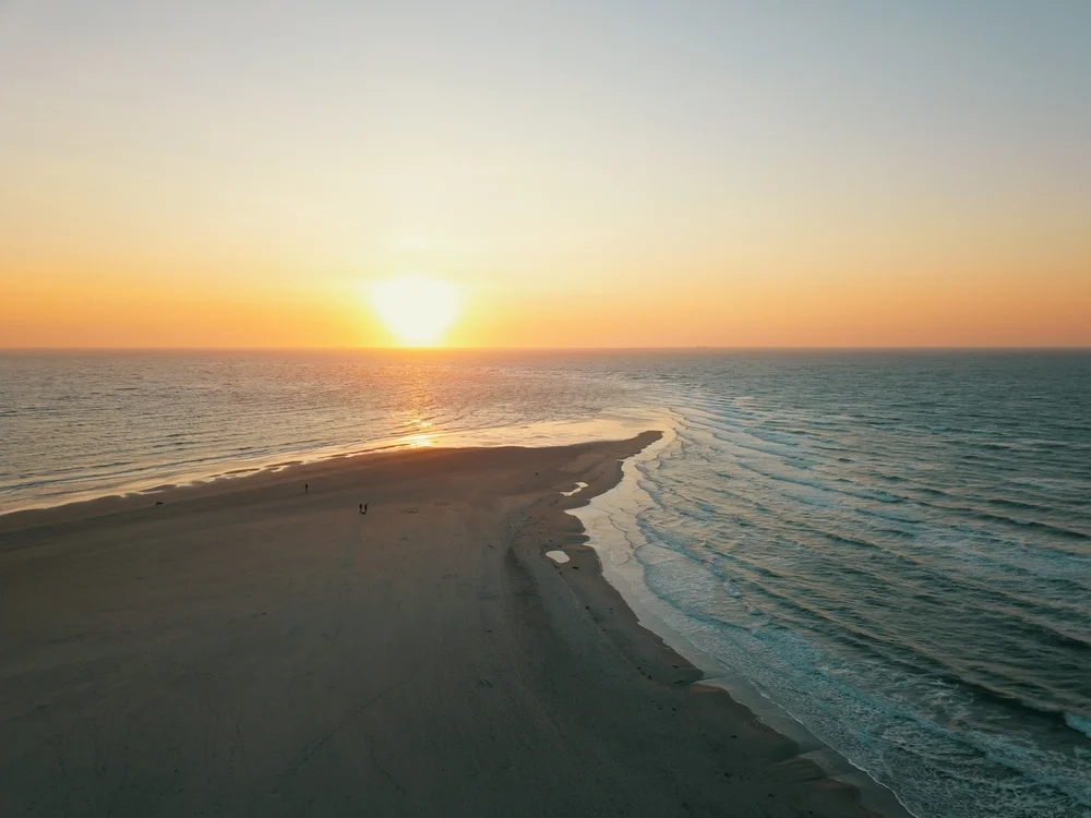 Watch the sunset at Skagen, where two seas meet