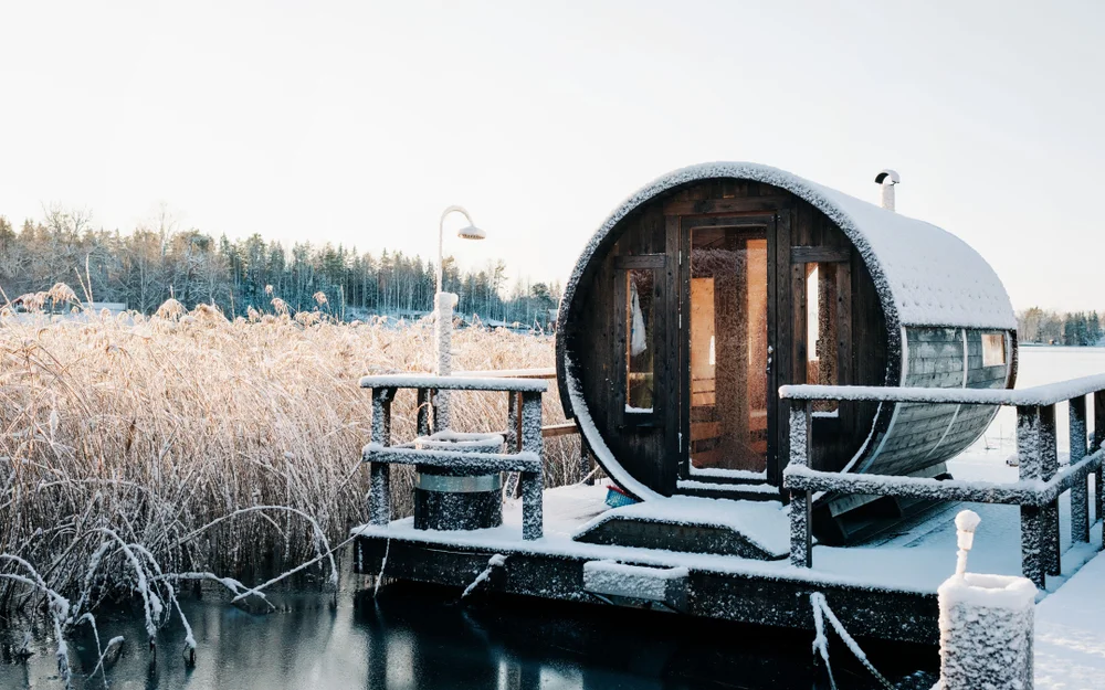 Dip into a frozen lake after sauna