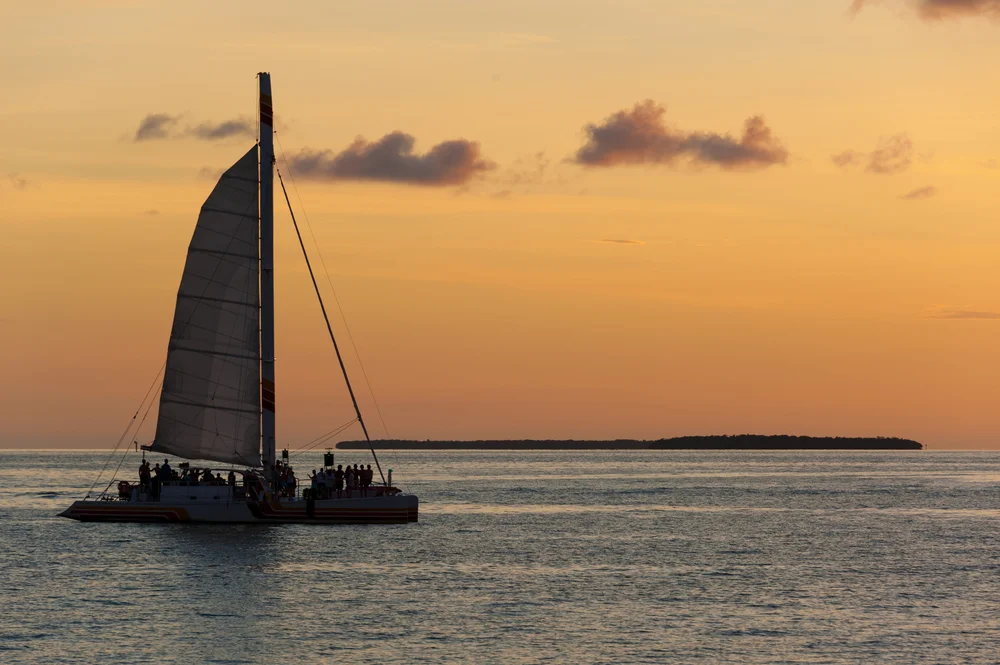 Enjoying a Catamaran Sunset Cruise Along the Coastline of Mahé