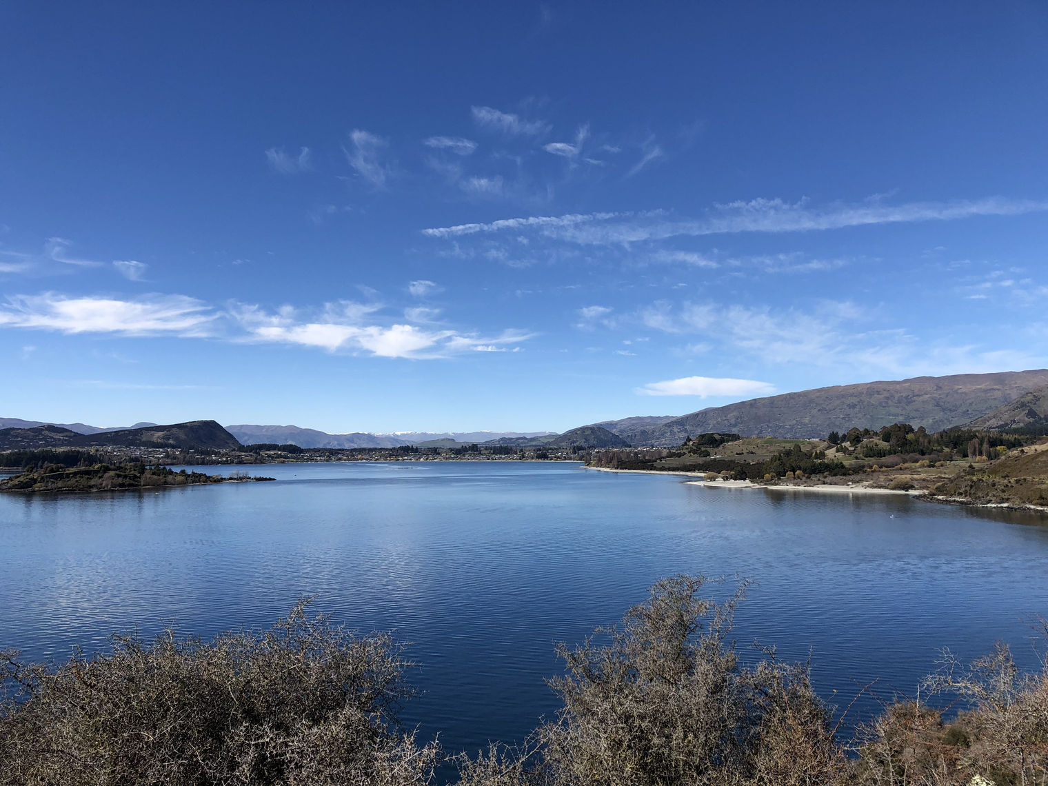 overlooking lake wanaka with mountains and hills in the background