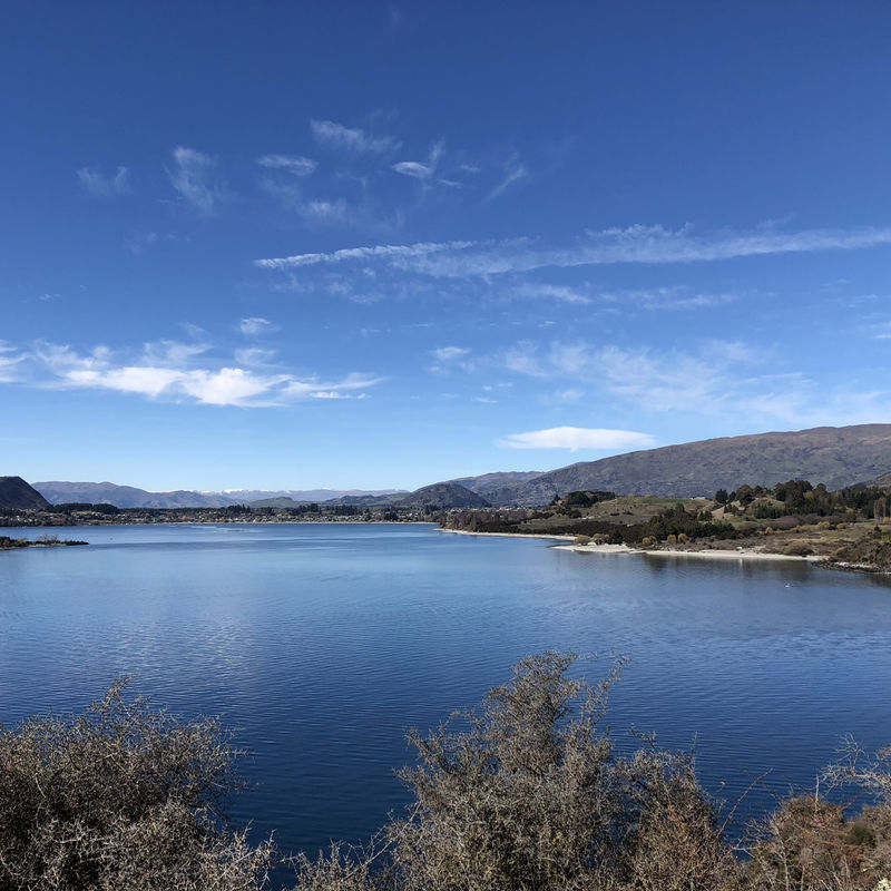 overlooking lake wanaka with mountains and hills in the background