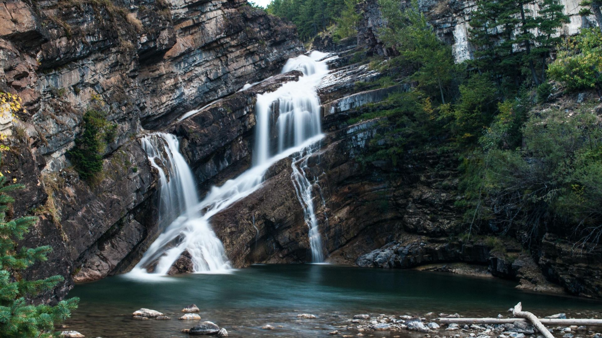 CA Alberta Waterton Lakes NP waterfall luis perdigao unsplash