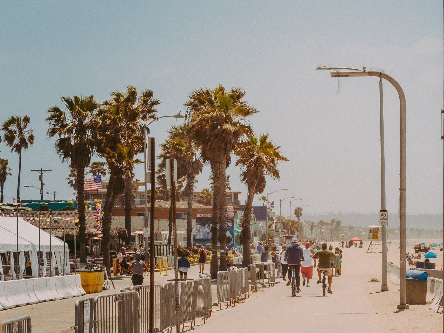 Cyclists and walkers travel along the back of Pacific Beach in San Diego