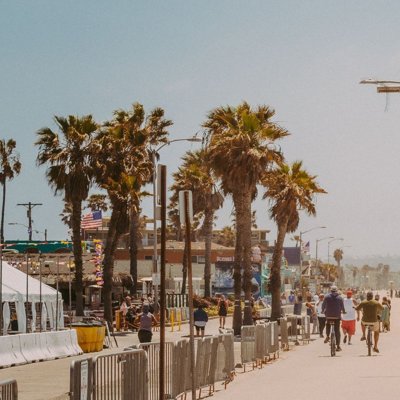 Cyclists and walkers travel along the back of Pacific Beach in San Diego