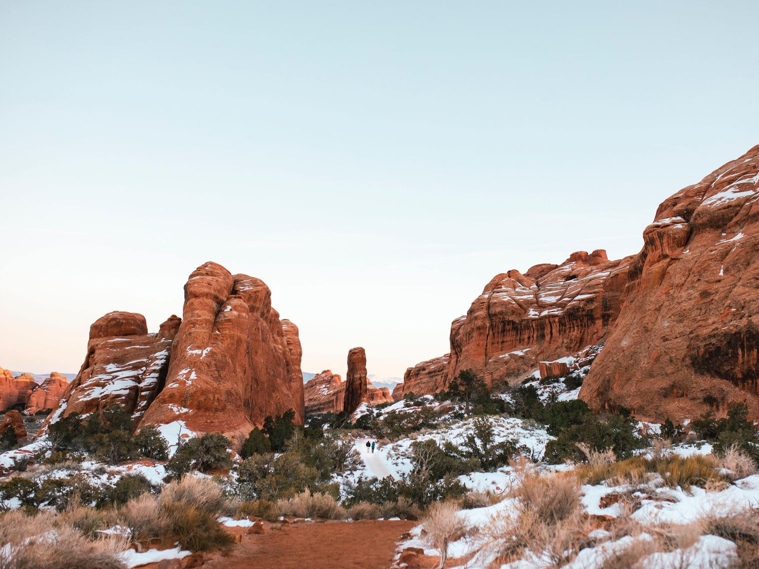 People walking through Arches National Park in Utah during winter