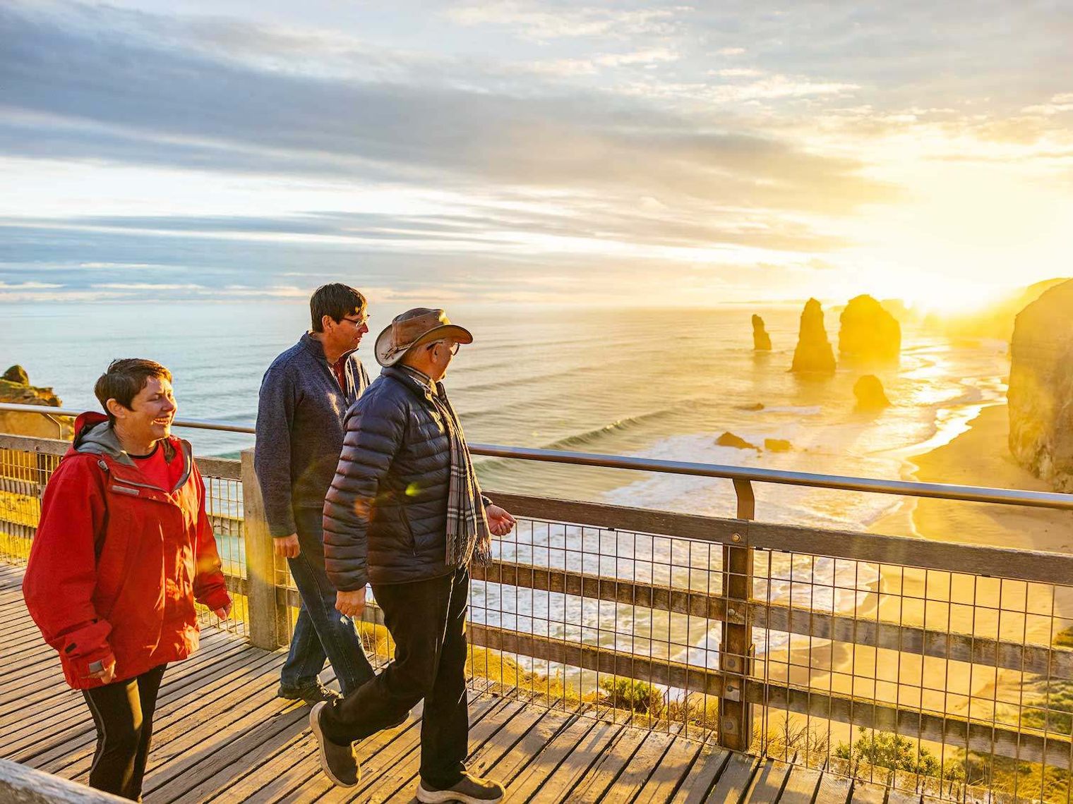 People walking looking towards the view of the twelve apostles