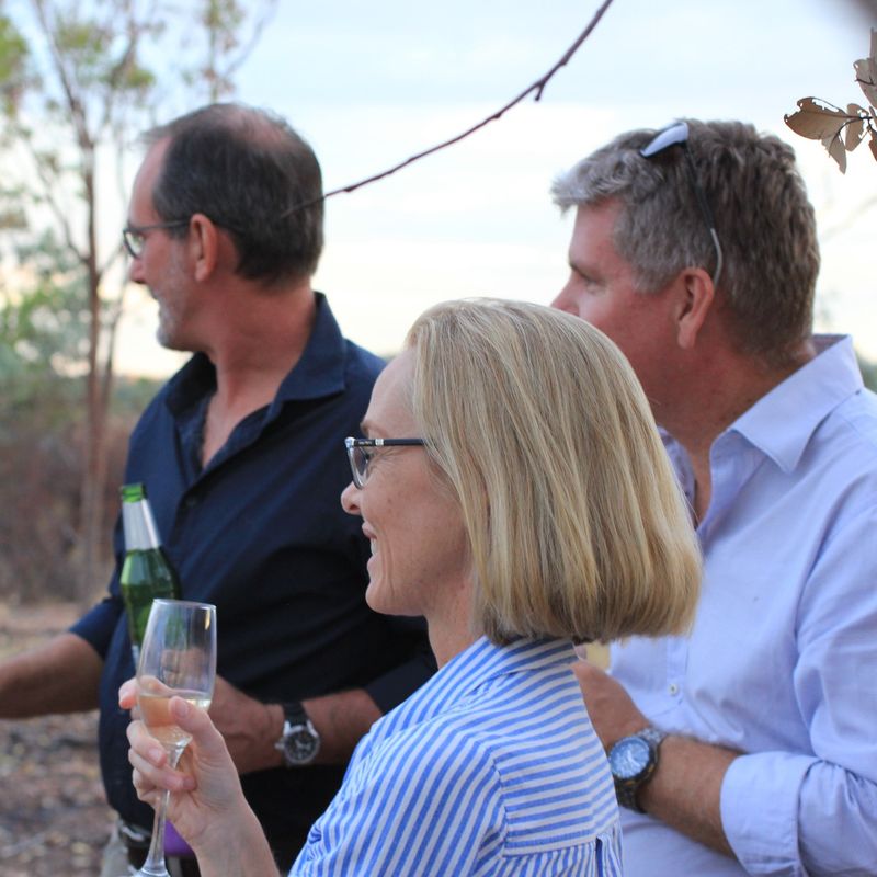 A group of people enjoy a drink in the Bungle Bungles, Australia