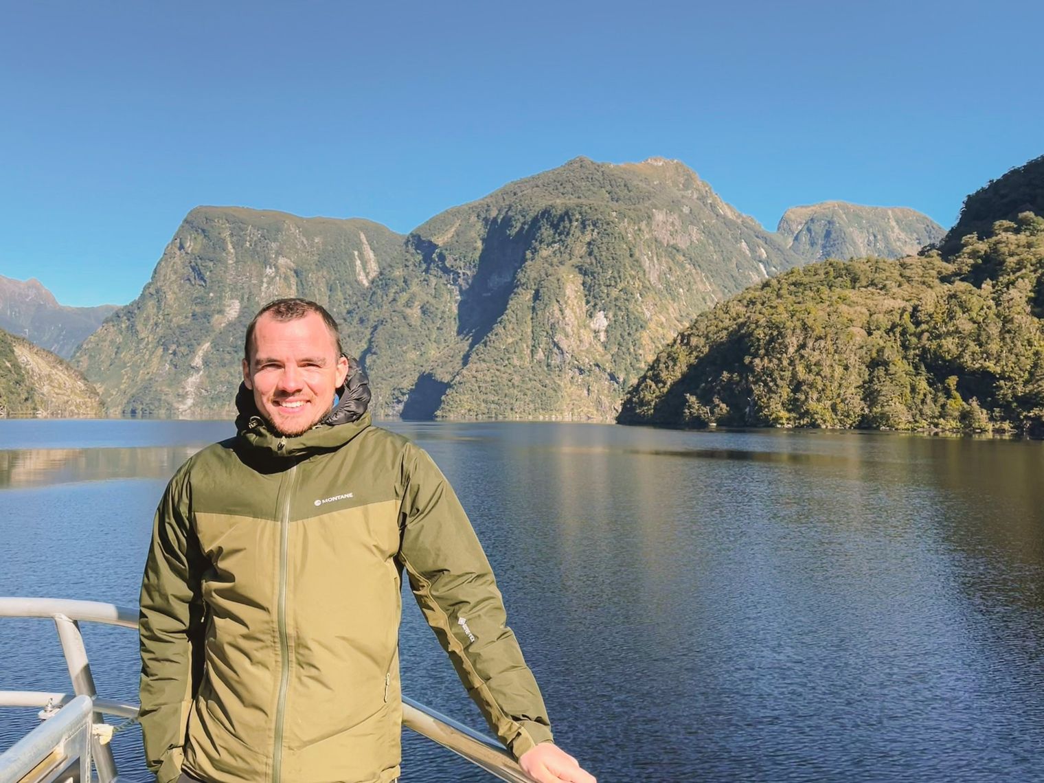 A picture of Kieran, Travelessence Expert, smiling at the camera in doubtful sounds