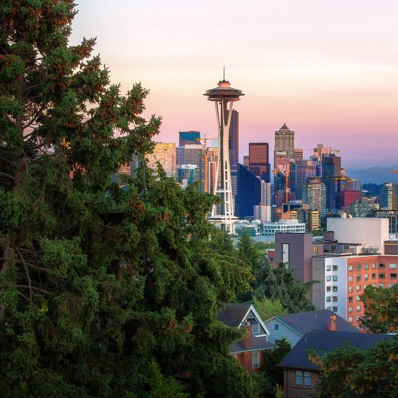 Seattle city skyline at sunset with mountain in background
