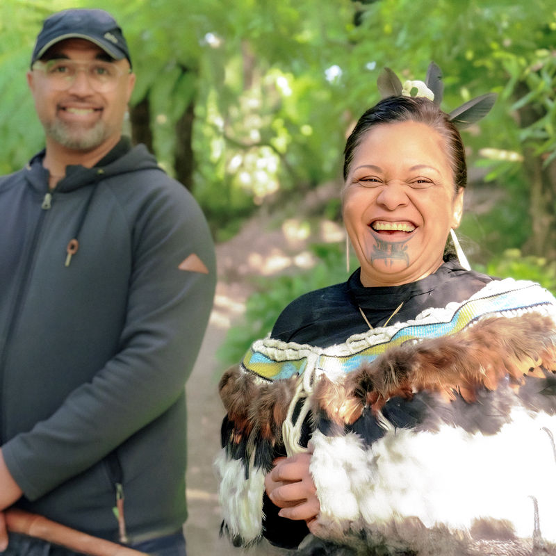 Local hosts smiling at the camera
