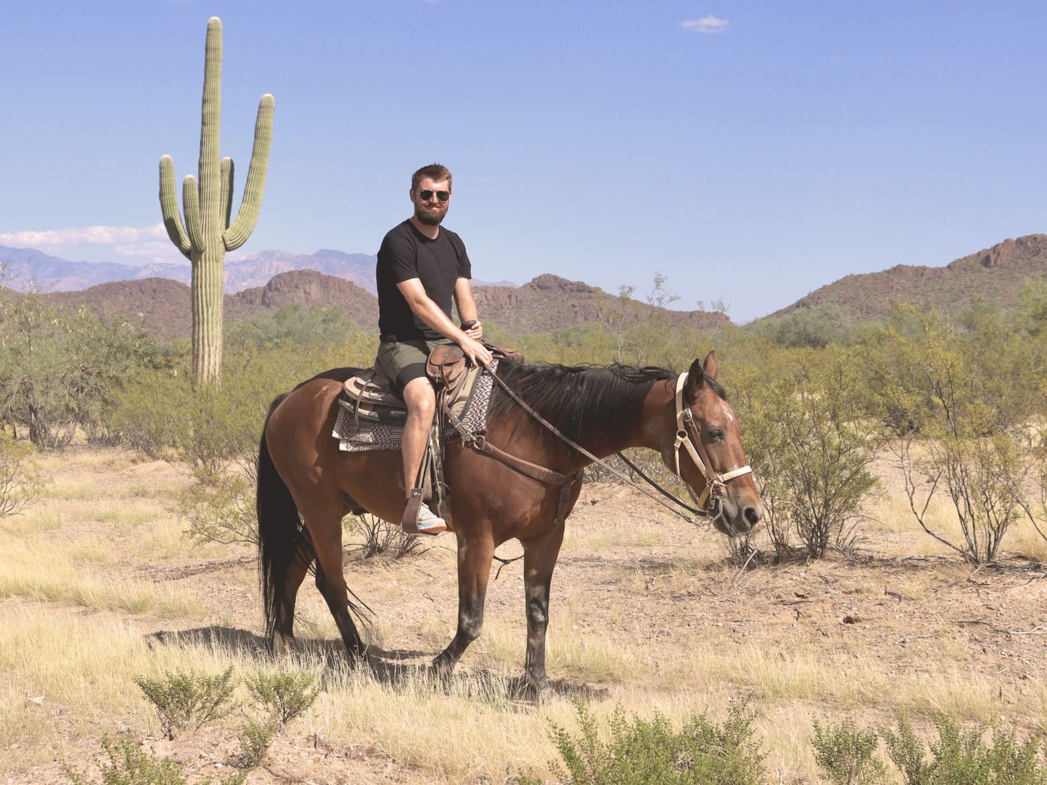 Luke, travelessence expert, on a horse