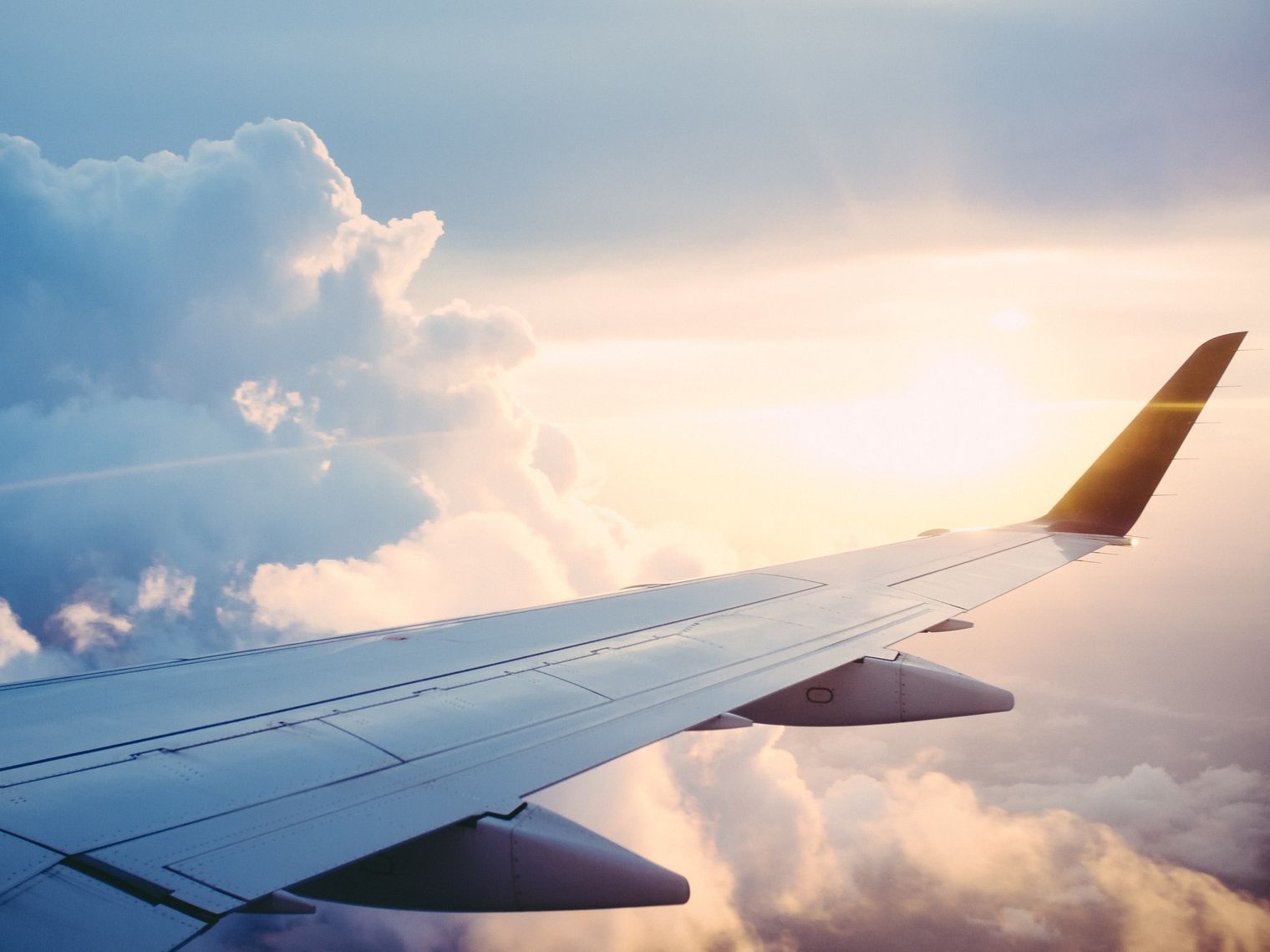 Travel airplane wing Ross parmly unsplash