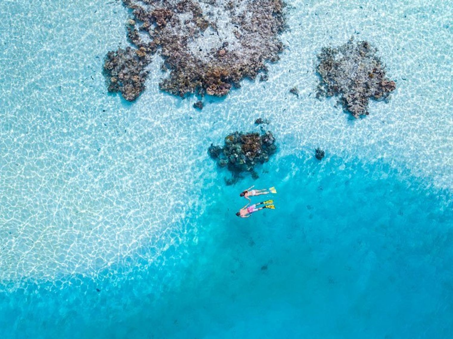 A couple snorkelling in the bays of Cook Islands