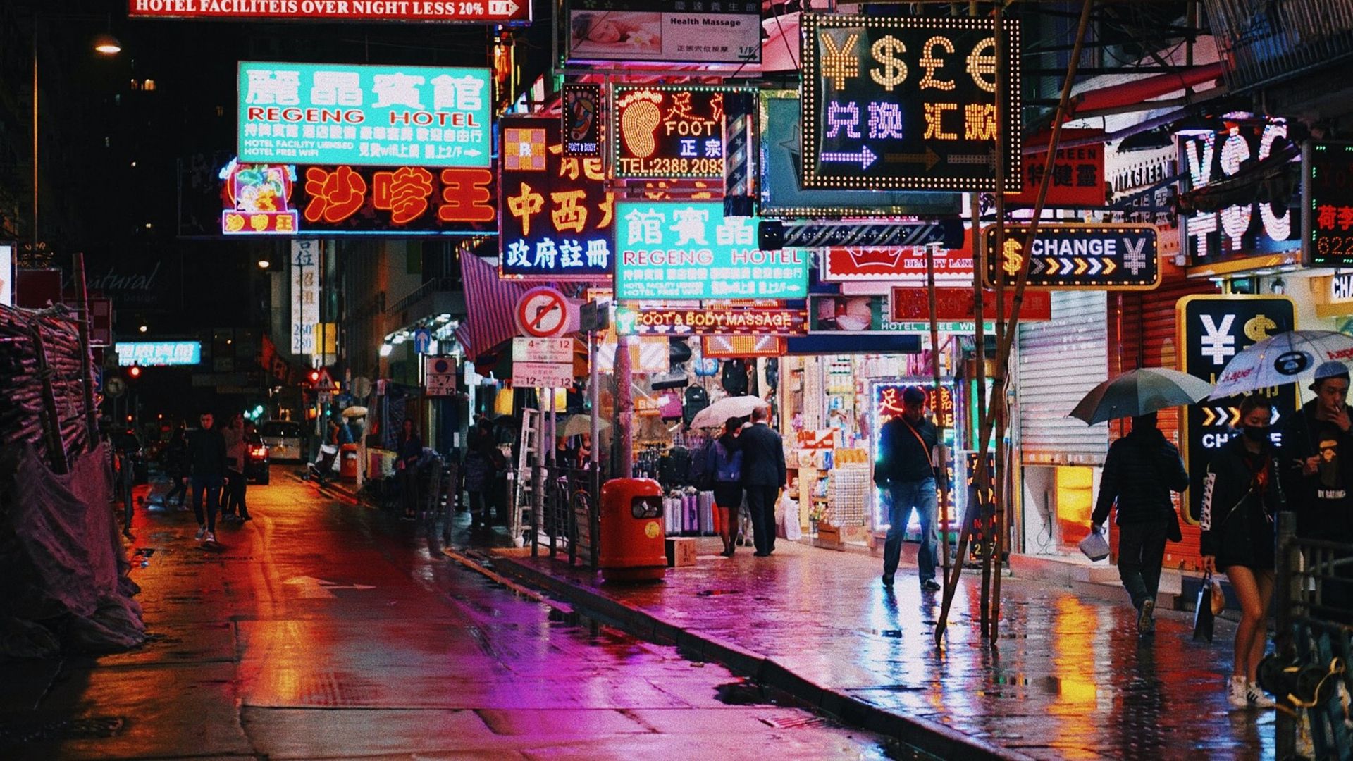 Street with neon lights at night in Hong Kong