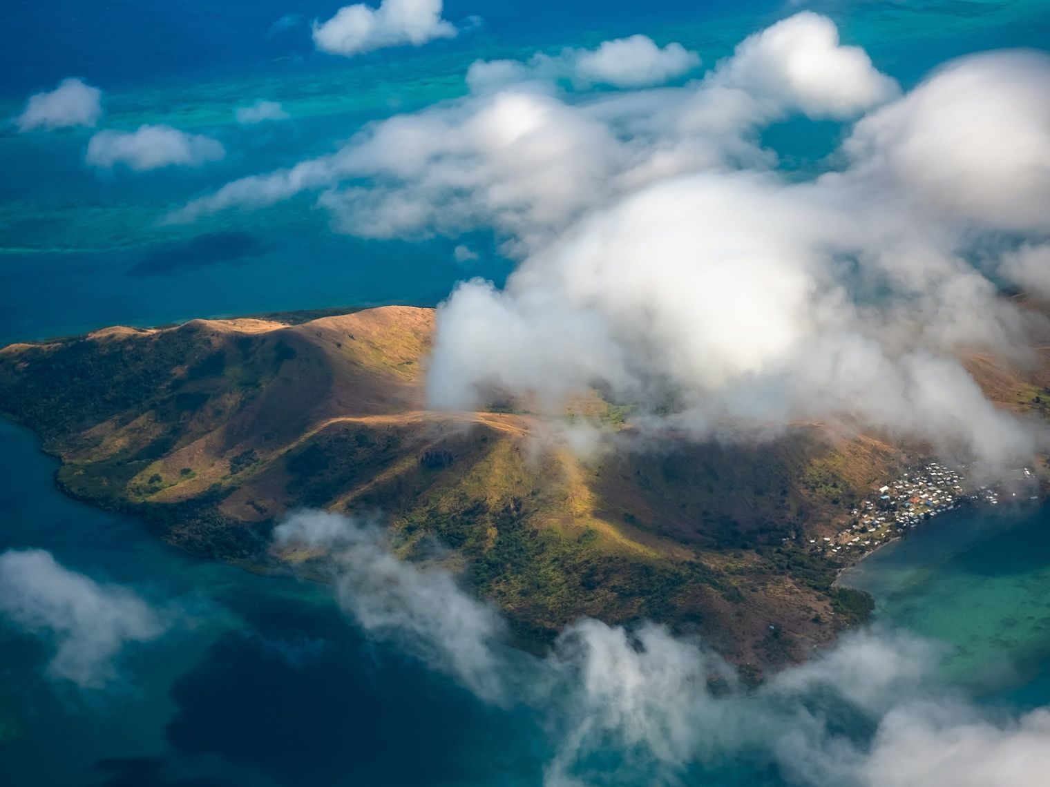 Aerial view of an island through the clouds