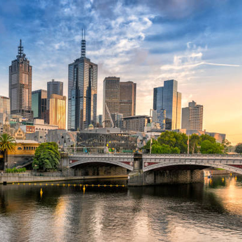The skyline of Melbourne, Australia from across the river at sunset