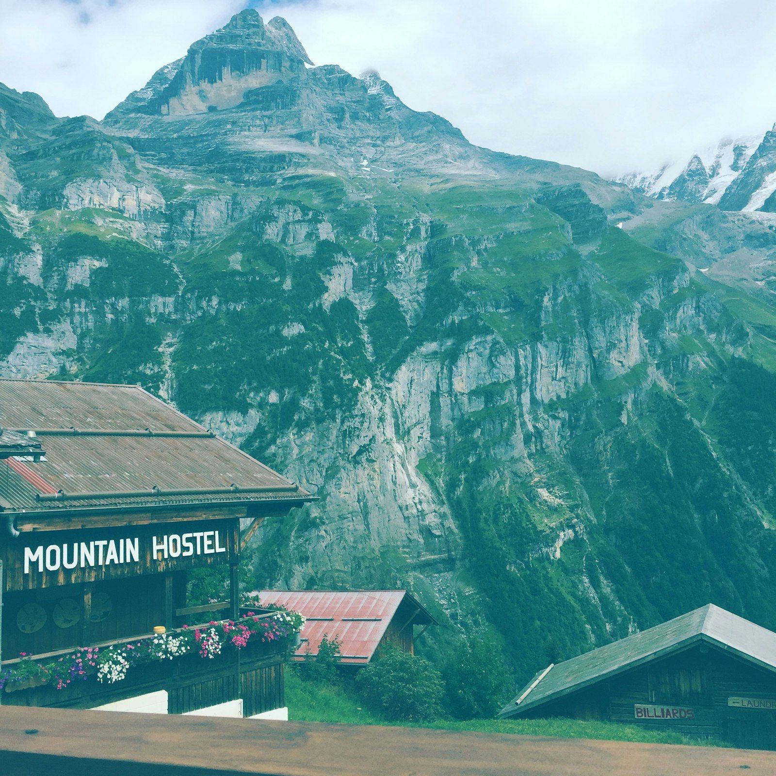 Sunrise Mountain Hostel — main building, mountain backdrop