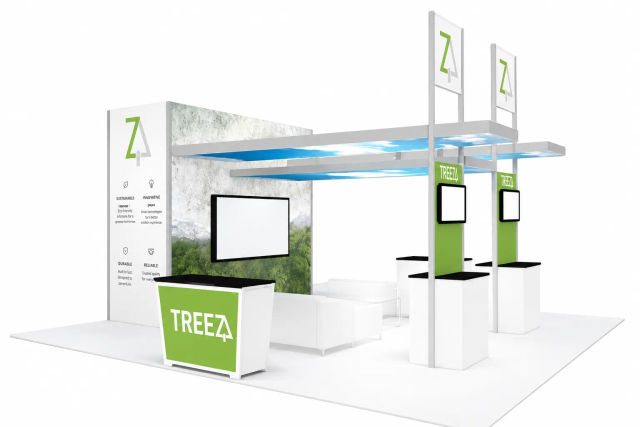 Island trade show booth with overhead canopies, tall signs and a reception counter