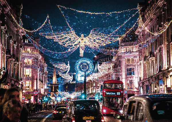 A street in London is lit up with Christmas lights.