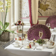 A table set up for afternoon tea in a hotel.