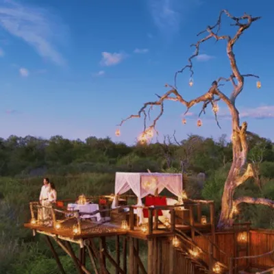 A translucent high-altitude balloon floats above Earth's atmosphere, glowing faintly against the dark space.
