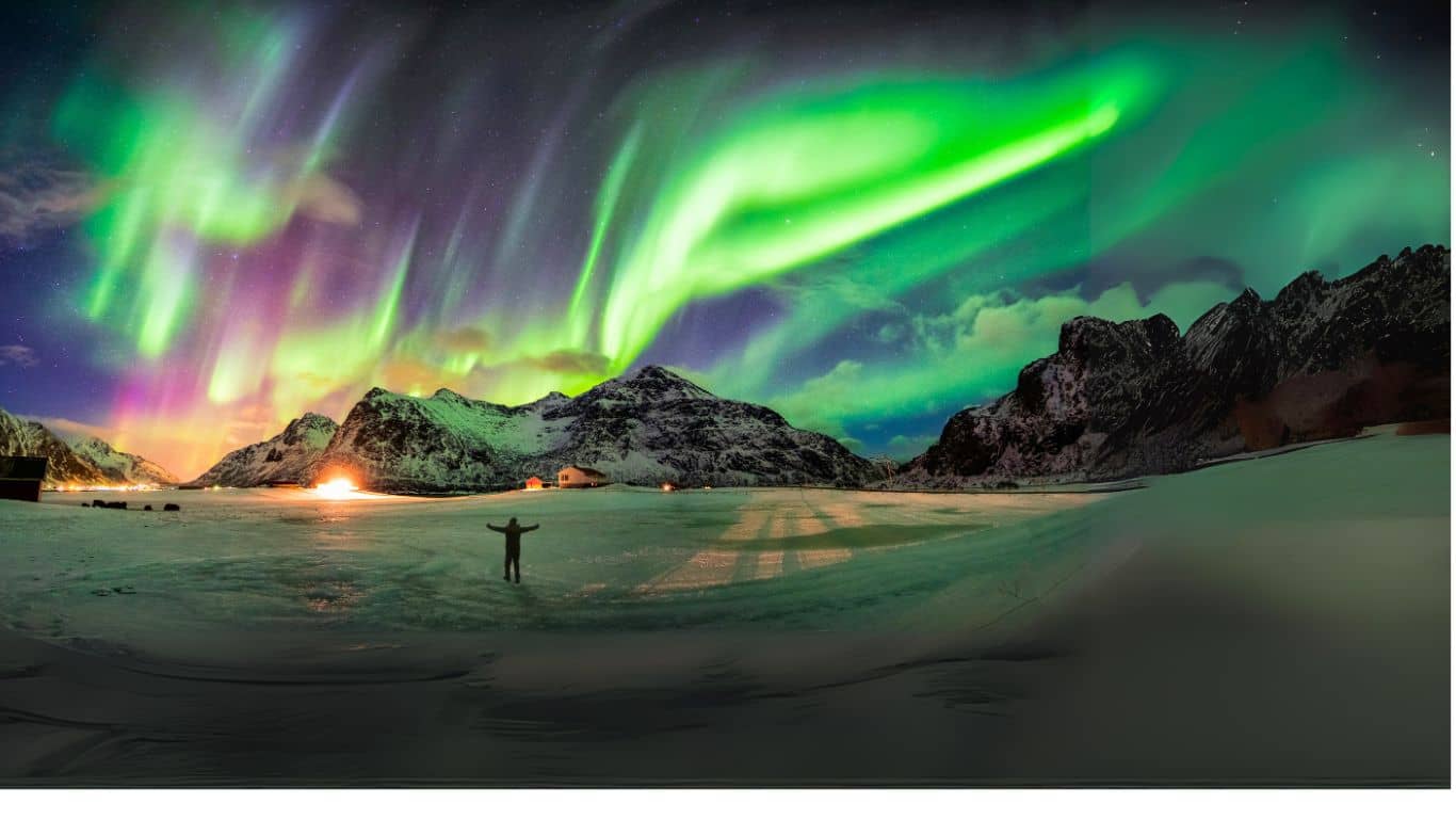 A man looking at a snow mountain.