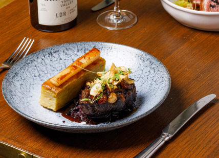 An image of a plate of food and wine, Five-Course Tasting Menu. 116 at The Athenaeum