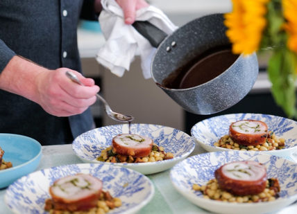 An image of a person pouring sauce on a plate, 7-Course Tasting Menu. Alex Dilling at Hotel Cafe Royal