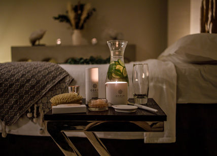 An image of a bed with a candle and a book, Renew and Refresh Spa Break. Alexander House Hotel