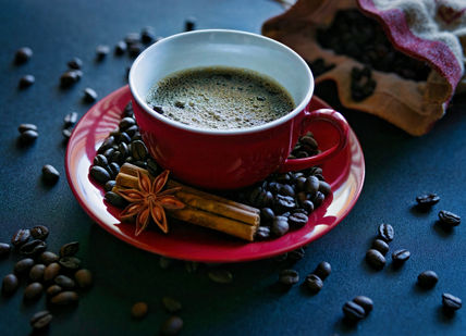 An image of a cup of coffee and beans, Home Brew Master Class. The Artisan Coffee School