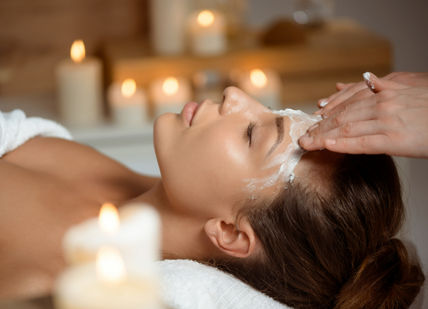 An image of a woman getting a facial massage, Absolute Spa Ritual for Her. Aurora Wellbeing Spa