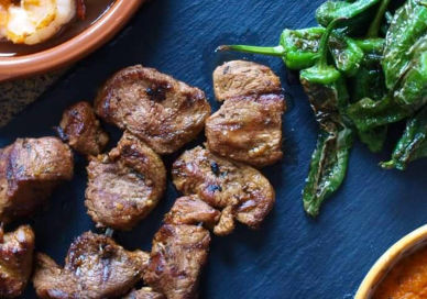 An image of some meat and vegetables on a table, Spanish Tapas Class. Avenue Cookery School