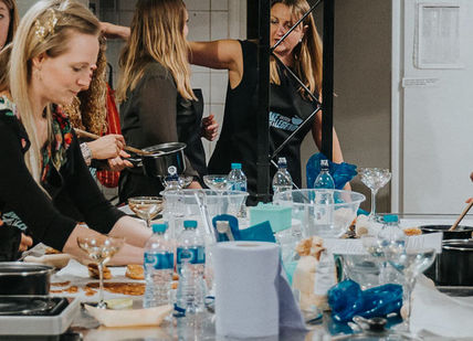 An image of a group of people at a table, Private Home Baking Class. Bake With A Legend