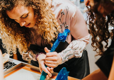 An image of a woman cutting a cake, Private Home Baking Class. Bake With A Legend