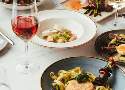 An image of a table with food and wine, Wine and Dine Experience. Balfour Winery