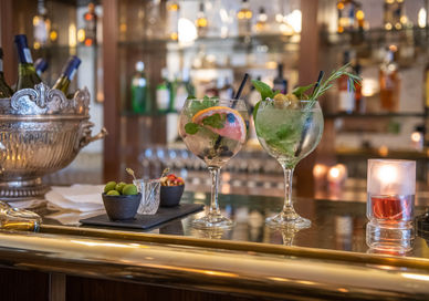 An image of a bar with a variety of drinks, Gin O’clock Sharing Platter. Bbar London