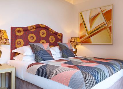 An image of a bed in a Cosy King room