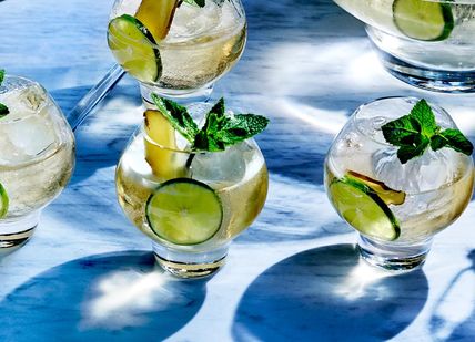 An image of a table with glasses of cocktails, Gin Masterclass with a guided tour. Bombay Sapphire Distillery