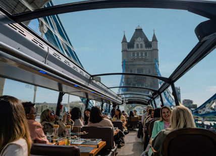 An image of people having Afternoon tea at bus,
