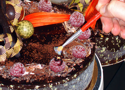 An image of a cake being cut into, Private Cupcake Masterclass and Afternoon Tea. Cake Boy