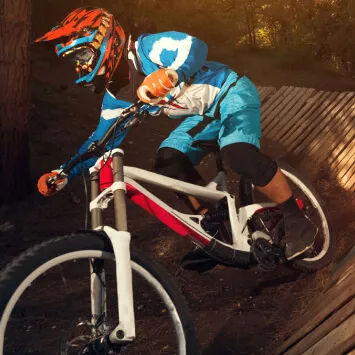 A man riding a mountain bike in the woods