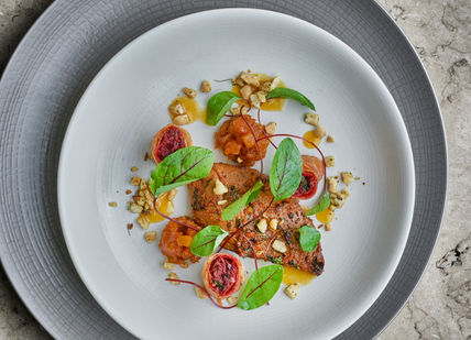 An image of a plate of food on a table, The Iconic Tasting Menu with Wine pairing. The Cinnamon Club