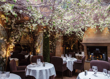 An image of a restaurant setting with tables and chairs, Five-course tasting menu. Clos Maggiore