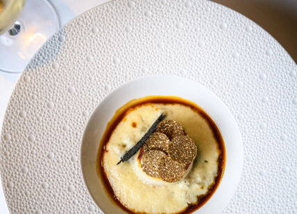 An image of a plate of food with a glass of wine, Weekday Three-Course Lunch. Clos Maggiore