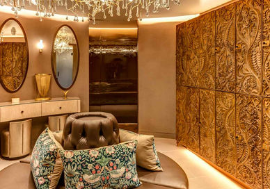 An image of a room with a couch and a mirror, Head to Toe Spa Experience. Cloud Twelve