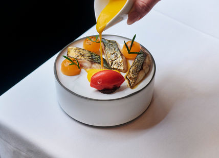 An image of a plate of food on a table, Eight-Course Tasting Menu. Club Gascon