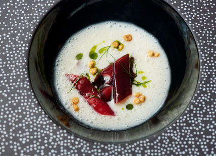 An image of a plate of food on a table, Six-Course Tasting Menu. Club Gascon