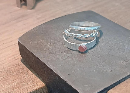 An image of hand made silver rings